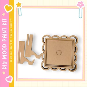 May include: DIY wood paint kit with a scalloped-edge square frame and two stand pieces. The frame has a central circle. The text "DIY WOOD PAINT KIT" and "IF WE CAN CREATE IT, YOU CAN MAKE IT!" are visible.