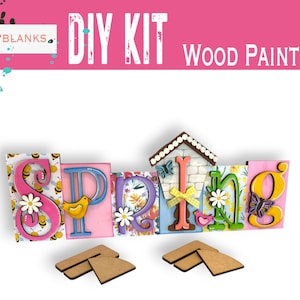 May include: DIY wood paint kit featuring the word "Spring" in colorful, decorated letters. The letters are decorated with flowers, butterflies, birds, and bees. The kit includes two wooden triangle stands.