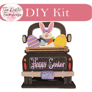May include: A DIY kit featuring a dark brown wooden truck cutout with a white bunny holding a carrot, a purple egg with yellow stripes, and a yellow egg with purple dots. The truck displays the text Happy Easter and a license plate reading HOP.