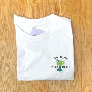 white unisex t shirt with embroidered margarita design