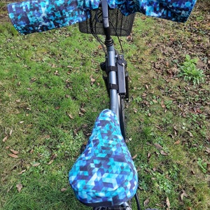 Warm, waterproof bike sleeves and saddle covers in blue tones image 1