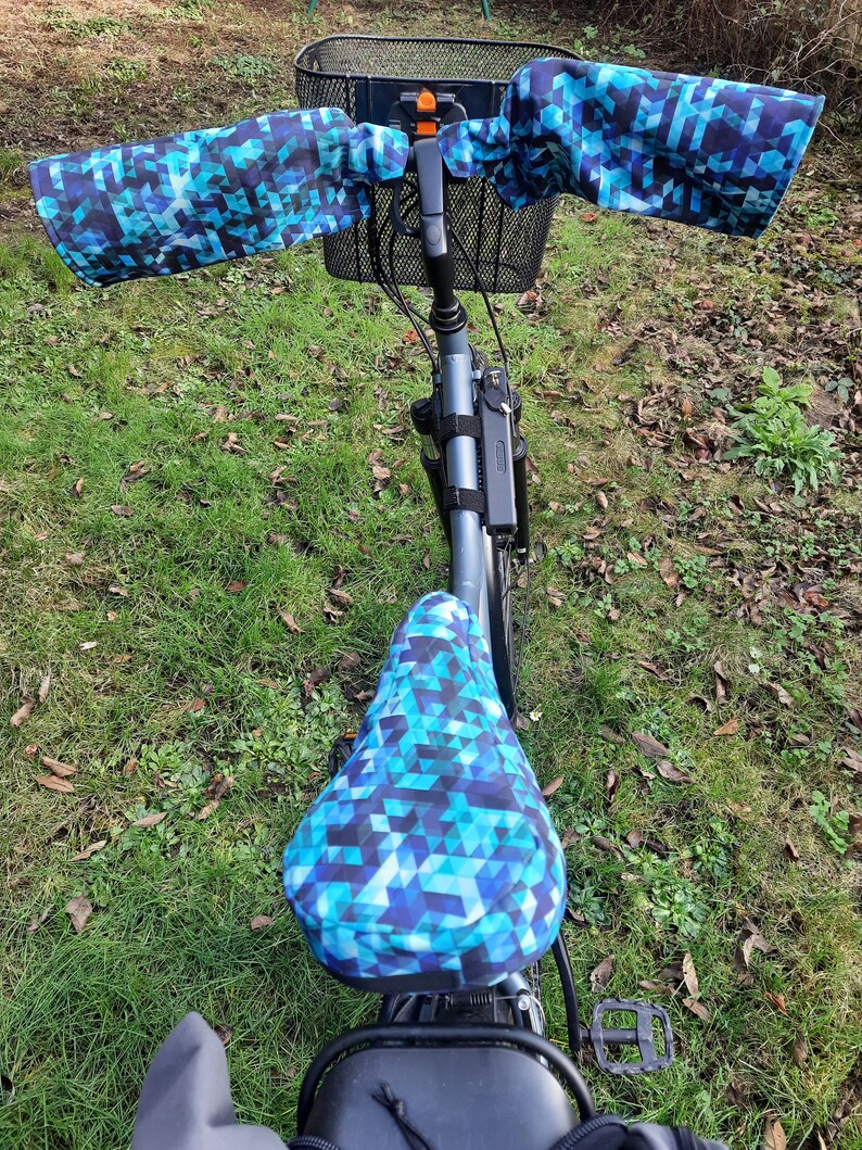 Warm, waterproof bike sleeves and saddle covers in blue tones image 1