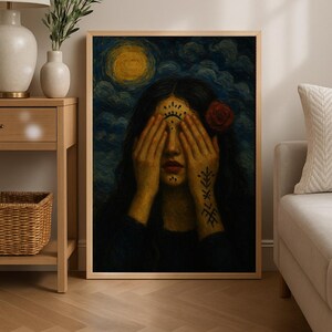 May include: A framed art print depicts a woman with long dark hair, eyes covered by hands, and a red rose. The background features a yellow moon and a dark blue sky with swirling clouds. The woman has tattoos on her arm and forehead.