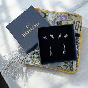 Silver & purple huggie earrings