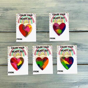 May include: Five colorful heart-shaped crayons with the text "Color Your Heart Out" and "From:" on white cards. The crayons are arranged in two rows of three.
