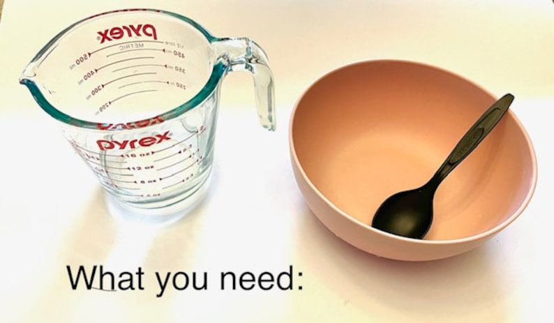 May include: A clear glass measuring cup with red markings and a pink bowl with a black plastic spoon. What you need:
