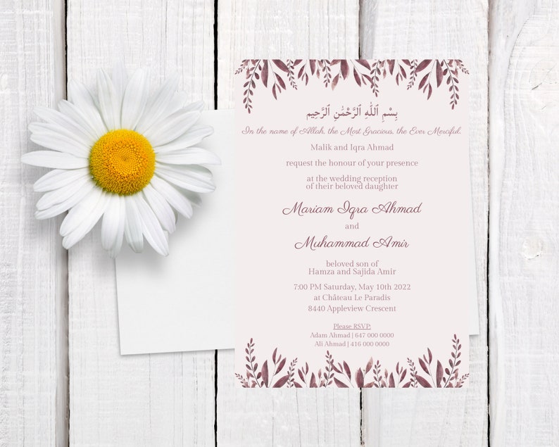 May include: A wedding invitation with floral accents and text in English and Arabic. The invitation features the names of the couple, event details, and RSVP information. A large white daisy with a yellow center is in the upper left corner.