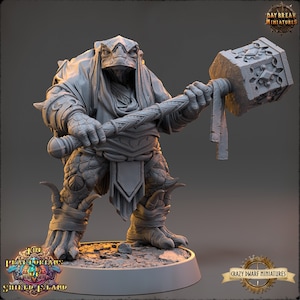 May include: A gray, detailed miniature of a turtle-like creature wielding a large hammer. The miniature is posed in a dynamic stance, with the creature's head turned and its hammer raised. The miniature is set on a circular base.