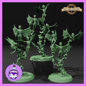 May include: A set of seven green plastic miniature figurines of winged demons, each perched on a swirling smoke base. The figurines are arranged in a circular pattern on three separate bases.