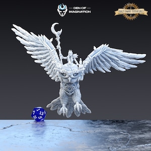 May include: A white 3D printed miniature of a female figure riding a large owl with outstretched wings. The owl has a detailed design with intricate patterns and a crescent moon on its head. The figure is holding a staff with a crescent moon at the top. The miniature is set against a gray background. "Den of Imagination" and "Crazy Dwarf Miniatures" are written on the top of the image.