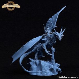 May include: A blue and white miniature figurine of a dragon rider. The rider is holding a sword and is perched atop a dragon with outstretched wings. The dragon is standing on a rocky base.