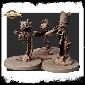 May include: Three beige miniature figures with skull-like heads and mechanical components. The figures are mounted on circular bases. The Crazy Dwarf Miniatures logo is in the upper left corner. The figures appear to be from a science fiction or fantasy genre.