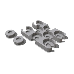 May include: A set of light gray plastic components consisting of two small circular rings with notched edges and a larger rectangular block featuring six integrated circular clips arranged in two rows of three, designed for holding small cylindrical items.