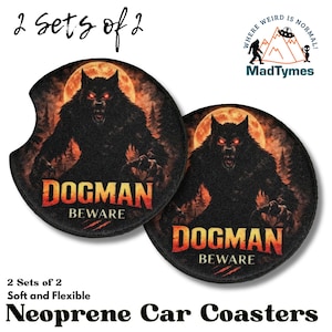 May include: Two black neoprene car coasters with a Dogman design. Each coaster features a menacing werewolf against a full moon and forest backdrop, with the text "DOGMAN BEWARE" in orange and red.