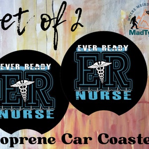May include: Set of two black round neoprene car coasters with a blue and white medical symbol and the text "Ever Ready ER Nurse" in white.