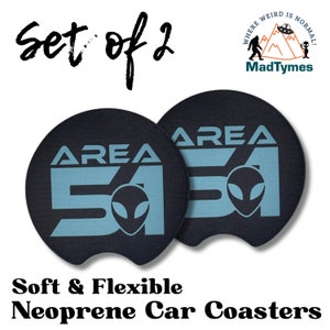 May include: Set of two black and blue neoprene car coasters with the text "AREA 51" and an alien graphic.