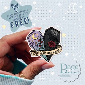 May include: A heart-shaped sticker with a split design. One side features a purple coffin with a crescent moon and candles, the other a black coffin with a crow and rose. Text reads "SPLIT SOUL one heart". A star-shaped graphic says "Buy 2...FREE!"