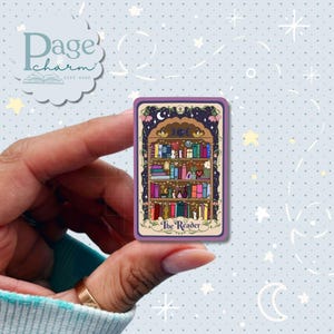 May include: A rectangular sticker featuring a tarot card design titled The Reader. The illustration depicts a wooden bookshelf filled with colorful books, small plants, and decorative items, framed by a dark purple border with floral accents.
