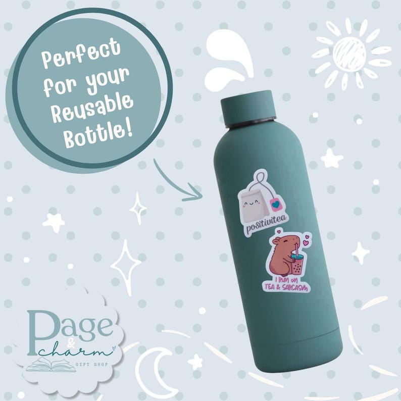 May include: A matte teal reusable water bottle featuring two stickers: one of a smiling tea bag with the text "positivitea" and another of a capybara drinking bubble tea with the text "I RUN ON TEA & SARCASM".