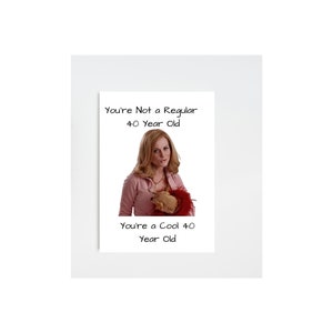 May include: A humorous greeting card featuring a woman holding a small dog. The card reads "You're Not a Regular 40 Year Old. You're a Cool 40 Year Old."