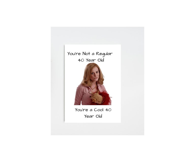 May include: A humorous greeting card featuring a woman holding a small dog. The card reads "You're Not a Regular 40 Year Old. You're a Cool 40 Year Old."