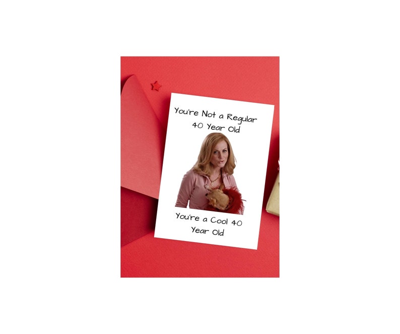 May include: A white card with a photo of a woman holding a stuffed animal. The text on the card reads "You're Not a Regular 40 Year Old. You're a Cool 40 Year Old."