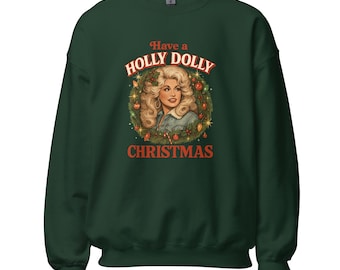 May include: Dark green sweatshirt with the text "Have a Holly Dolly Christmas" above a portrait of a woman with blonde hair. The portrait is surrounded by a wreath of greenery and ornaments.