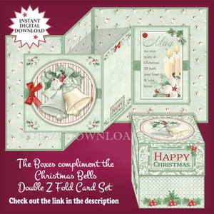 May include: A green and white Christmas card set with a double Z fold design. The card features a red bow, holly, and two silver bells. The card also includes a small box with a green and white design and the words "Happy Christmas".