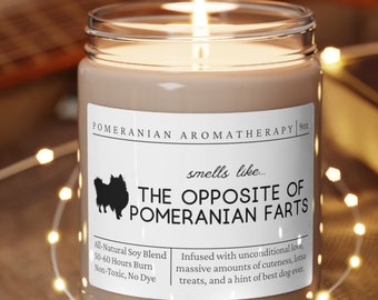 May include: A brown candle with a white label that reads "Pomeranian Aromatherapy" and "smells like... THE OPPOSITE OF POMERANIAN FARTS". The label also includes the text "All Natural Soy Blend", "50-40 Hours Burn", "Non-Toxic, No Dye", and "Infused with unconditional love, massive amounts of cuteness, treats, and a hint of best dog ever."