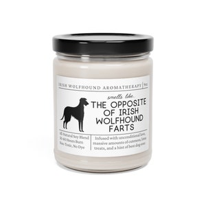 May include: A scented candle in a glass jar with a black lid. The label says "IRISH WOLFHOUND AROMATHERAPY" and "smells like... THE OPPOSITE OF IRISH WOLFHOUND FARTS." The candle is 255 grams and made with all-natural soy blend.