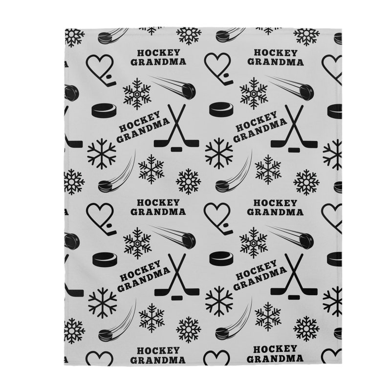May include: A gray and black patterned fabric with the text "Hockey Grandma" repeated throughout. The pattern includes hockey sticks, pucks, snowflakes, and hearts.