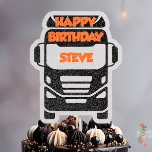 May include: Black and white truck cake topper with orange glitter lettering that says "Happy Birthday Steve".