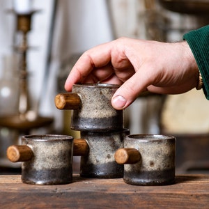 Set of four espresso mugs. Cozy coffee mugs. Small ceramic mugs with wooden handles. Handmade coffee mugs with juniper wood handles.