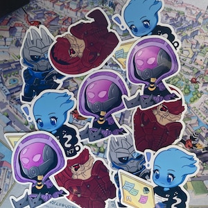 May include: A collection of colorful stickers featuring stylized characters in various poses. The stickers showcase characters with blue, purple, and red color schemes, some wearing helmets or armor. The background is a map with text.