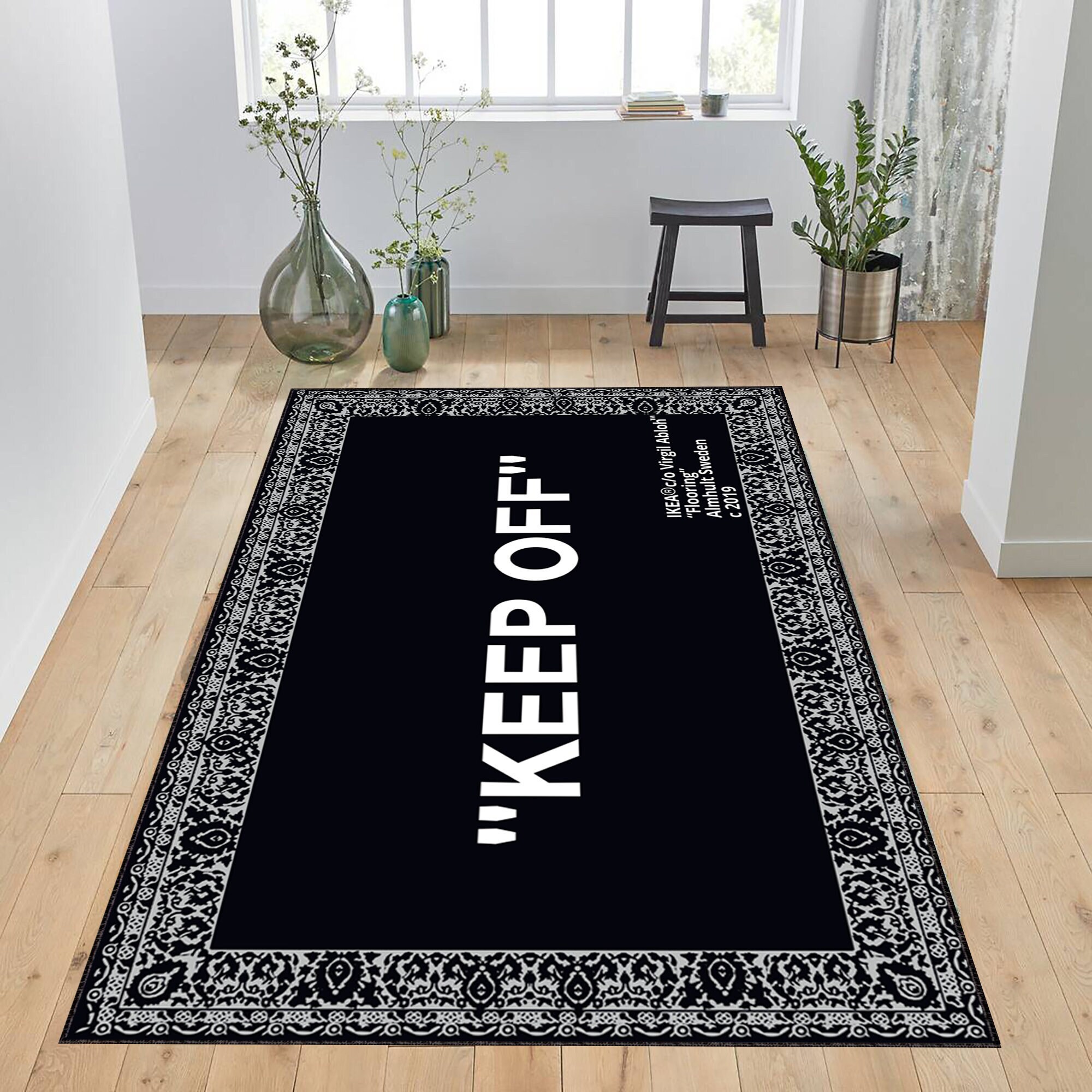View of the Virgil Abloh's KEEP OFF IKEA rug on display at an