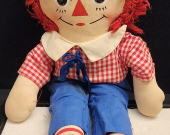 Vintage: Estimated 1960s Knickerbocker Raggedy Andy Doll with Blue pants, striped legs, and a plaid shirt, yarn hair