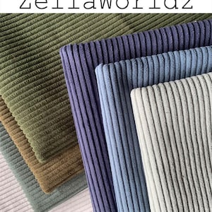 May include: Close-up of various corduroy fabric swatches in shades of green, brown, blue, and gray. The fabric has a ribbed texture. The text "ZellaWorldz" is at the top of the image.