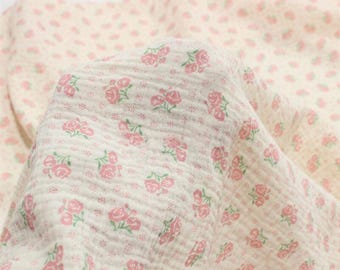 May include: Cream-colored fabric with a delicate floral pattern of pink roses and green leaves. The fabric is soft and textured, with the text "ZellaWorldz" at the top.