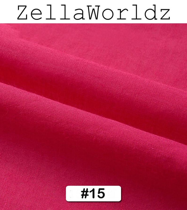 Peut inclure: Gros plan sur un tissu fuchsia vif, r&eacute;v&eacute;lant sa texture et ses plis. Le texte "ZellaWorldz" est en haut, et un rectangle blanc avec le num&eacute;ro "#15" est en bas. Le tissu est de couleur unie.