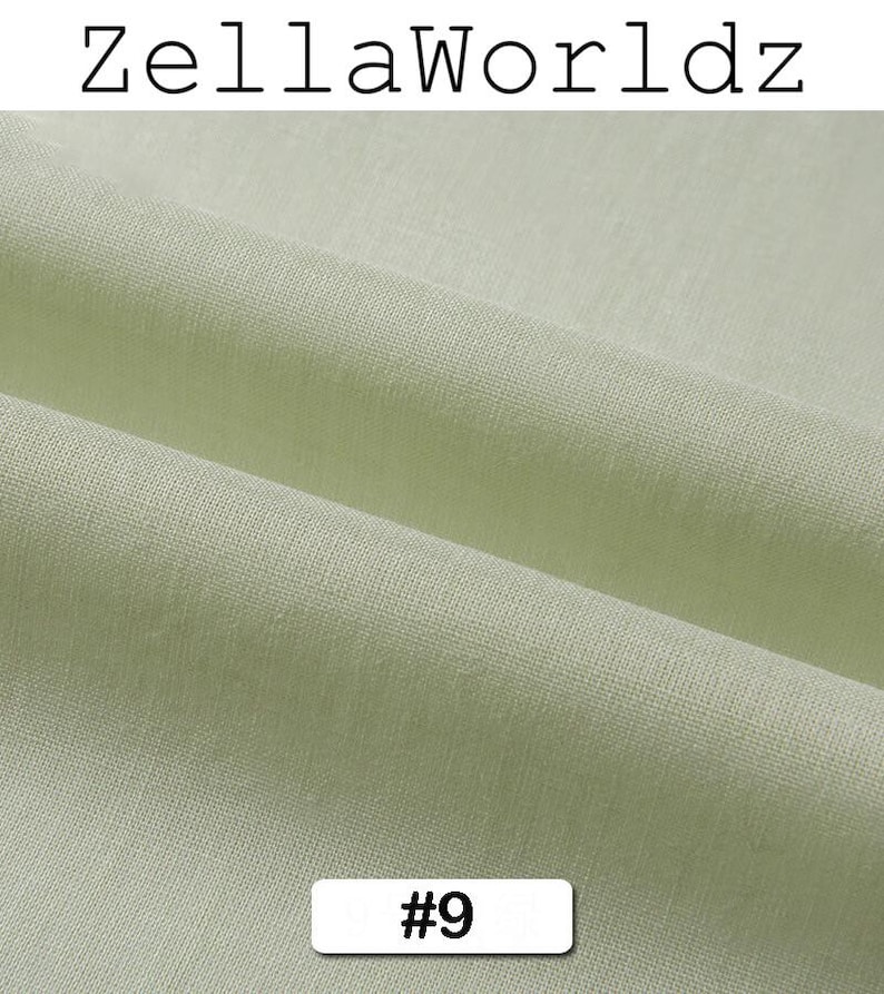 Peut inclure: Gros plan sur un tissu vert clair avec une texture et des plis visibles. Le texte "ZellaWorldz" est en haut, et un rectangle blanc avec le num&eacute;ro "#9" est en bas. Le tissu semble &ecirc;tre une mati&egrave;re douce.
