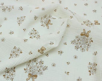 May include: Cream-colored fabric with a repeating pattern of floral bouquets, bows, and teddy bears in shades of brown. The fabric has a crinkled texture and the text "ZellaWorldz" is printed at the top.