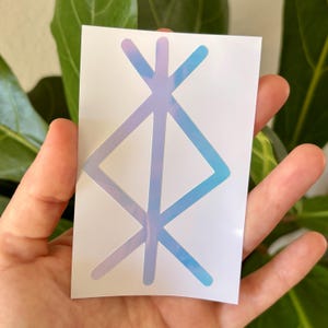 May include: A white sticker featuring a geometric design with a gradient of blue and purple hues. The design is composed of intersecting lines and shapes, creating a unique and eye-catching visual.