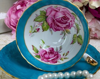 Vintage Turquoise Blue Aynsley Teacup and Saucer with Pink Cabbage Rose Center and textured lace pattern, made in england