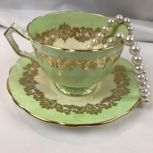 Vintage 1930s Aynsley mint green and cream crocus tea cup and saucer with gold filigree, unused, pattern C959/2
