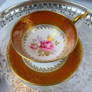 Vintage Aynsley orange teacup and saucer with pink cabbage roses, pristine and unused