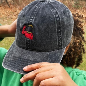Waving Astronaut Embroidered Dad Hat - Vintage Black Baseball Cap