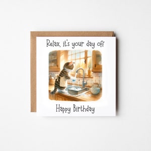 May include: A birthday card featuring a cartoon cat washing dishes in a kitchen sink. The card reads "Relax, it's your day off" and "Happy Birthday".