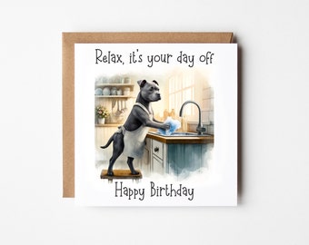 May include: A square greeting card with a watercolor illustration of a gray dog wearing an apron, washing dishes in a kitchen sink. The text "Relax, it's your day off" and "Happy Birthday" are printed on the card.