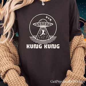 Resident Alien t-shirt, Kung Kung T-Shirt, Alien UFO t-shirt, Resident Alien Merch, Resident Alien Catchphrase, Law and Order Parody t-shirt