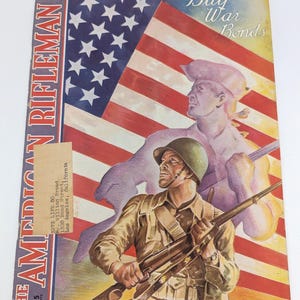 Vintage July 1943 war time issue of The American Rifleman magazine with iconic cover art - V4264